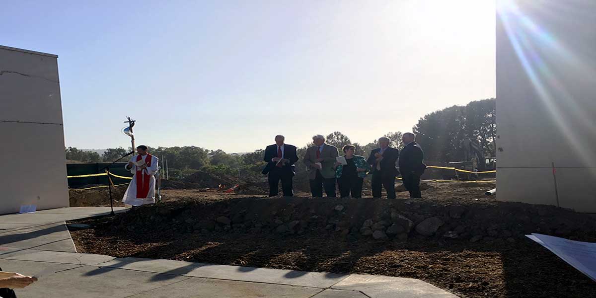 Pastor Anderson conducts Ground Blessing Ceremony in front of on campus construction site